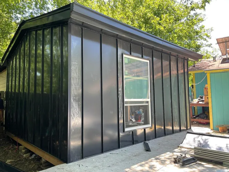 Black standing seam metal wall panels for Roof Inspection in Country Homes